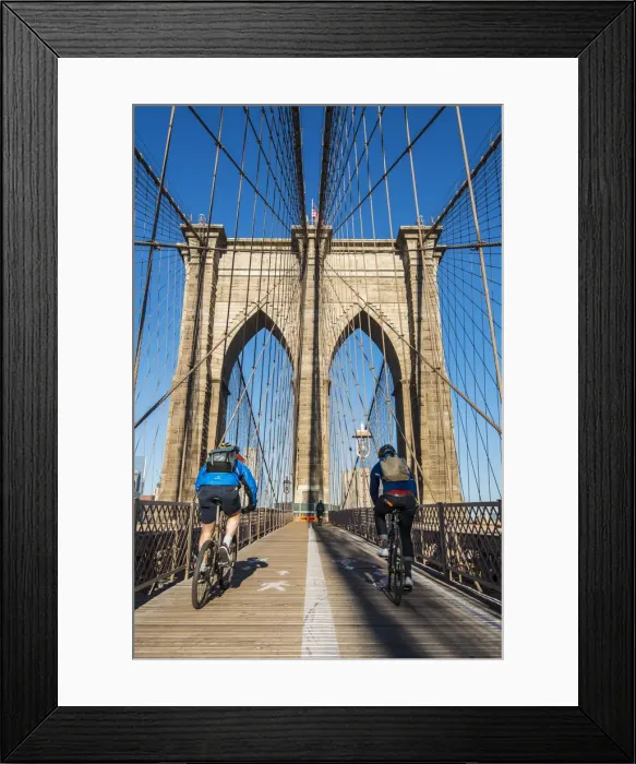 Framed Print : Cyclists riding their bikes on Brooklyn Bridge, New York, USA Framed Print : Cyclists riding their bikes on Brooklyn Bridge, New York, USA