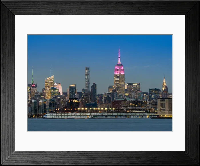 Framed Print : Midtown skyline at dusk with the Empire State Building in pink and white colors, Manhattan Framed Print : Midtown skyline at dusk with the Empire State Building in pink and white colors, Manhattan
