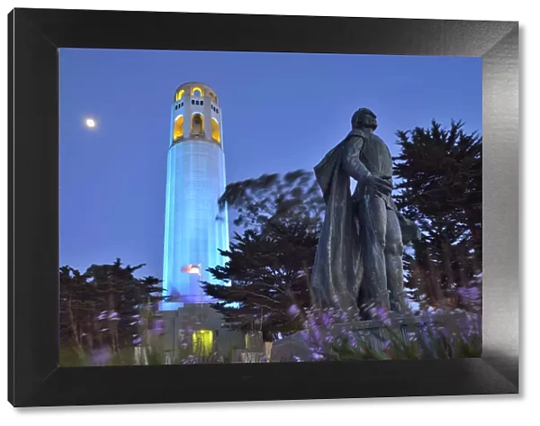Coit tower and Christopher Columbus statue at night, San Francisco, USA