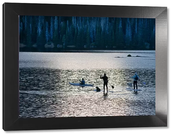Moonlight paddle boarding on Sparks Lake, Central Oregon, USA