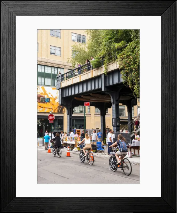 Framed Print : Tourists cycling under the High Line, New York, USA Framed Print : Tourists cycling under the High Line, New York, USA