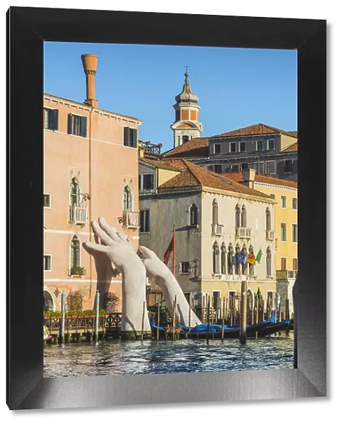 The giant hands rising from the water, an artwork by Lorenzo Quinn. Venice, Veneto, Italy