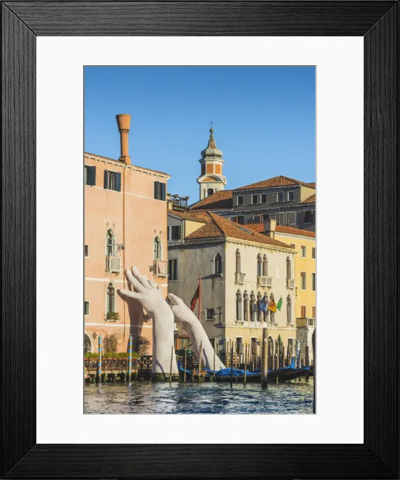 Framed Print : The giant hands rising from the water, an artwork by Lorenzo Quinn. Venice, Veneto, Italy