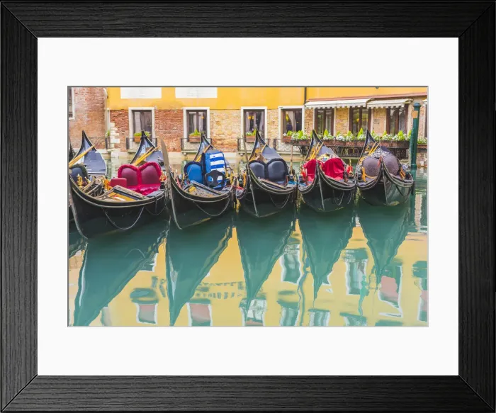 Framed Print : Venice, Veneto, Italy. Colorful moored gondolas reflecting in the water Framed Print : Venice, Veneto, Italy. Colorful moored gondolas reflecting in the water
