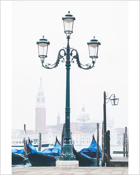 Venice, Veneto, Italy. Waterfront of Riva degli Schiavoni on a misty morning