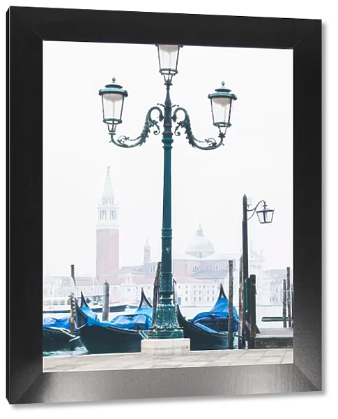 Venice, Veneto, Italy. Waterfront of Riva degli Schiavoni on a misty morning
