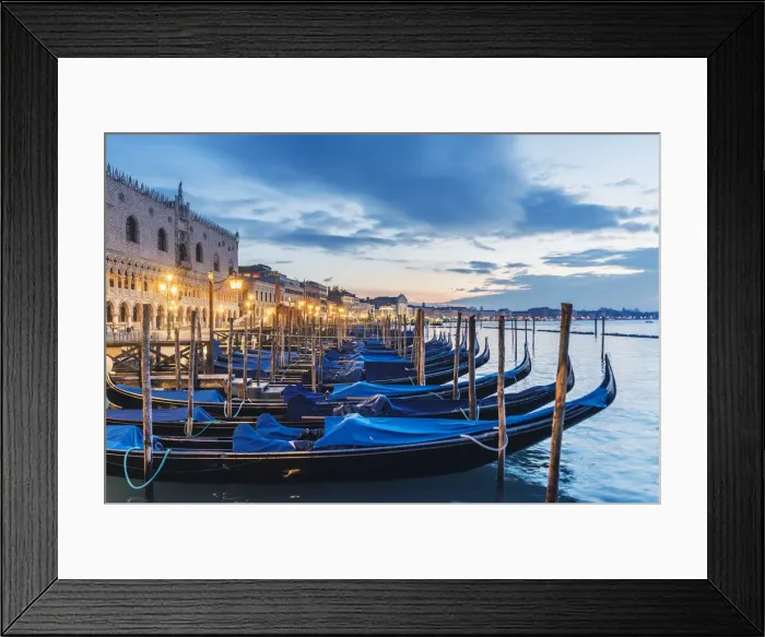 Framed Print : Venice, Veneto, Italy. Gondolas moored on the waterfront of St Marks basin at dusk Framed Print : Venice, Veneto, Italy. Gondolas moored on the waterfront of St Marks basin at dusk