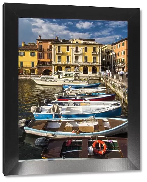 Boats moored in the harbor of Malcesine, Lake Garda, Veneto, Italy