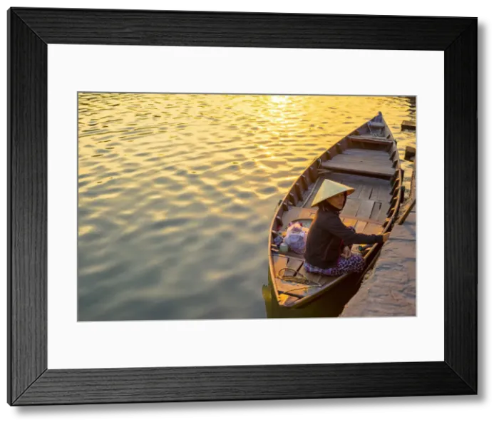 Framed Print : Vietnamese woman in a boat on the Thu Bon River at sunset, Hoi An, Quang Nam Province Framed Print : Vietnamese woman in a boat on the Thu Bon River at sunset, Hoi An, Quang Nam Province