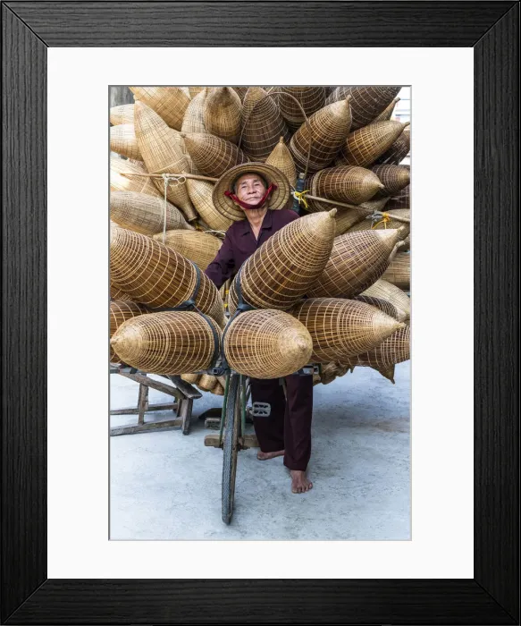 Framed Print : A portrait of a man on the bicycle loaded with the conical bamboo fish traps, near Hanoi Framed Print : A portrait of a man on the bicycle loaded with the conical bamboo fish traps, near Hanoi