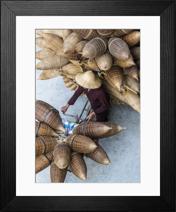 Framed Print : A man on the bicycle loaded with the conical bamboo fish traps, near Hanoi, Vietnam Framed Print : A man on the bicycle loaded with the conical bamboo fish traps, near Hanoi, Vietnam