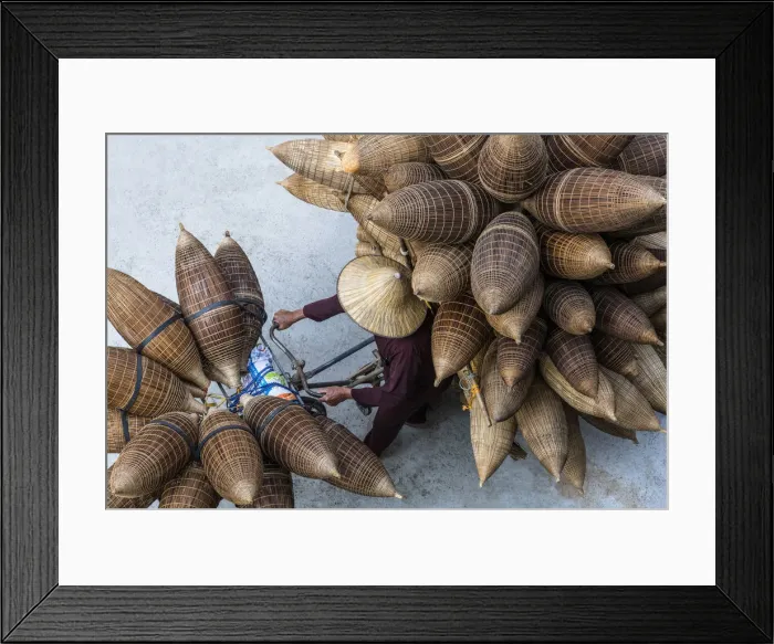 Framed Print : A man on the bicycle loaded with the conical bamboo fish traps, near Hanoi, Vietnam Framed Print : A man on the bicycle loaded with the conical bamboo fish traps, near Hanoi, Vietnam