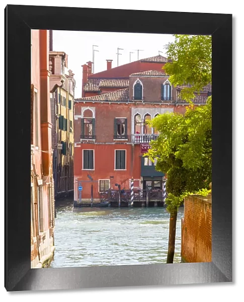 Venice, Veneto, Italy. Buildings and boats in the canals