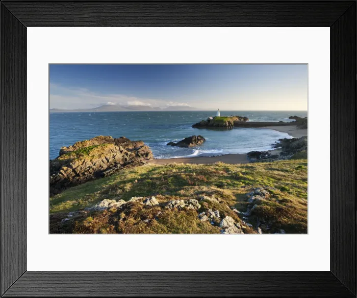 Framed Print : Early evening view of Pilots Cove and the beacon lighthouse T?r Bach on Llanddwyn Island Framed Print : Early evening view of Pilots Cove and the beacon lighthouse T?r Bach on Llanddwyn Island