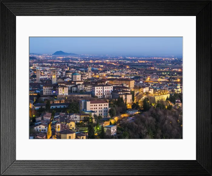 Framed Print : Bergamo, Lombardy, Italy. High angle view over Upper Town (Citta Alta) at dusk Framed Print : Bergamo, Lombardy, Italy. High angle view over Upper Town (Citta Alta) at dusk