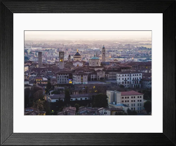 Framed Print : Bergamo, Lombardy, Italy. High angle view over Upper Town (Citta Alta) at dusk Framed Print : Bergamo, Lombardy, Italy. High angle view over Upper Town (Citta Alta) at dusk