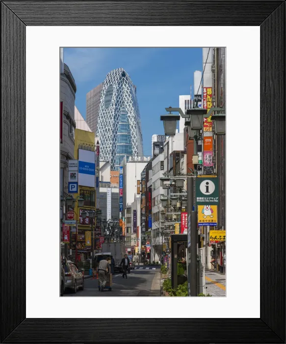 Framed Print : Street in Shinjuku district with Cocoon Tower in the background, Tokyo, Japan Framed Print : Street in Shinjuku district with Cocoon Tower in the background, Tokyo, Japan