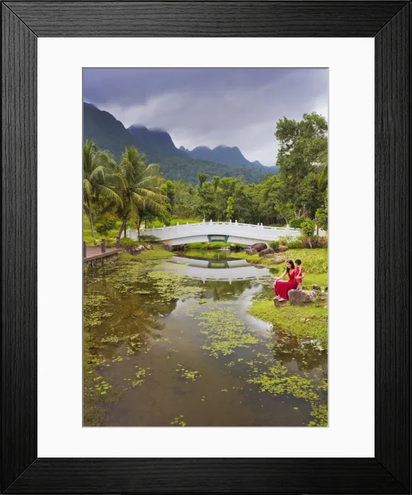 Framed Print : Malaysia, Langkawi, Oriental Gardens, Woman and girl sitting by lake MR Framed Print : Malaysia, Langkawi, Oriental Gardens, Woman and girl sitting by lake MR