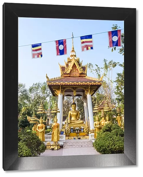 Laos, Vientiane. Small votive altar inside Wat Sisaket temple complex