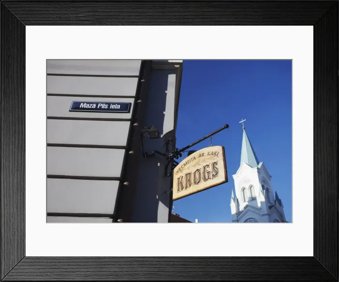 Framed Print : Shop sign and church spire, Riga, Latvia Framed Print : Shop sign and church spire, Riga, Latvia