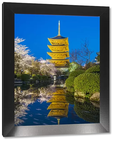 The pagoda of Toji Temple reflected in the pond at night, Kyoto, Japan