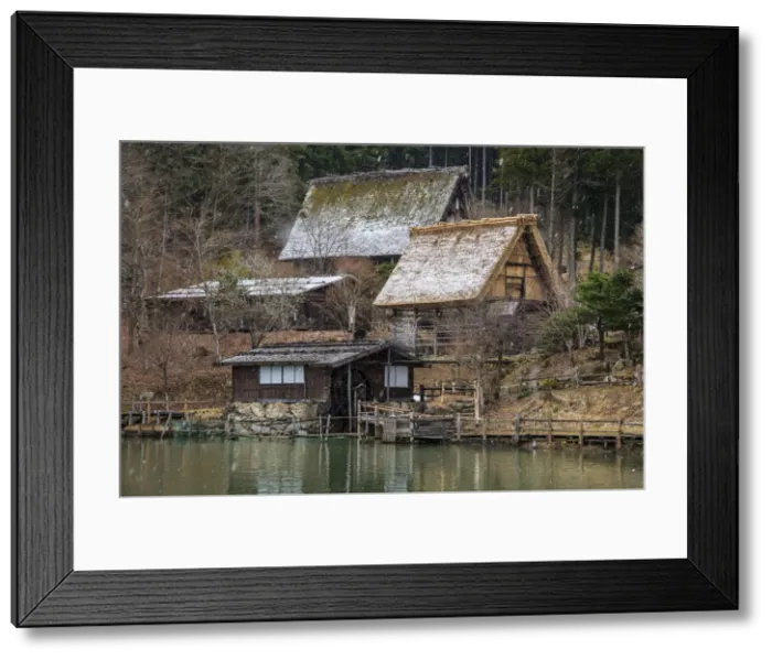 Framed Print : Old farmhouses under a snowfall at Hida Minzoku Mura Folk Village, Takayama, Gifu Framed Print : Old farmhouses under a snowfall at Hida Minzoku Mura Folk Village, Takayama, Gifu