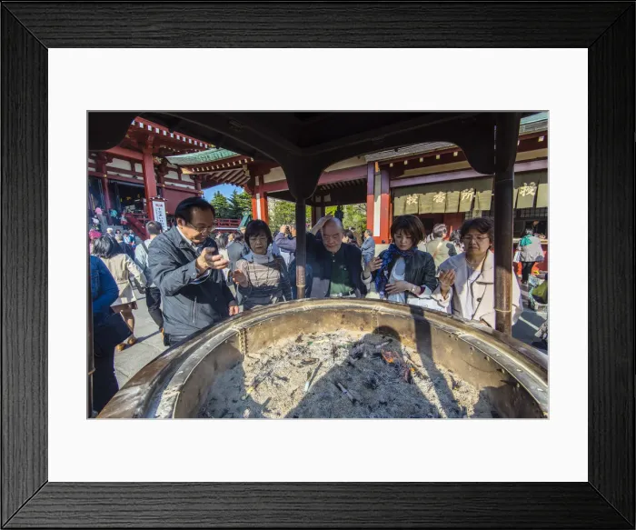 Framed Print : Japanese worshippers rubbing with the so said healthy smoke coming from the large Framed Print : Japanese worshippers rubbing with the so said healthy smoke coming from the large