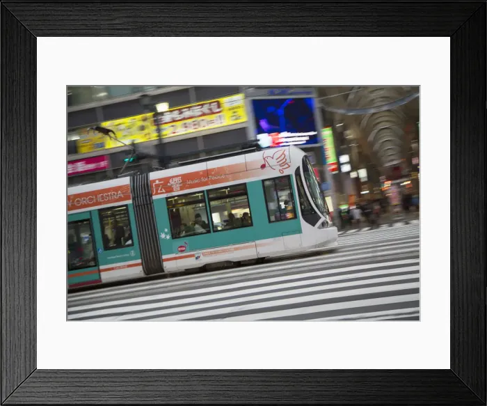 Framed Print : Tram passing along street, Hiroshima, Hiroshima Prefecture, Japan Framed Print : Tram passing along street, Hiroshima, Hiroshima Prefecture, Japan