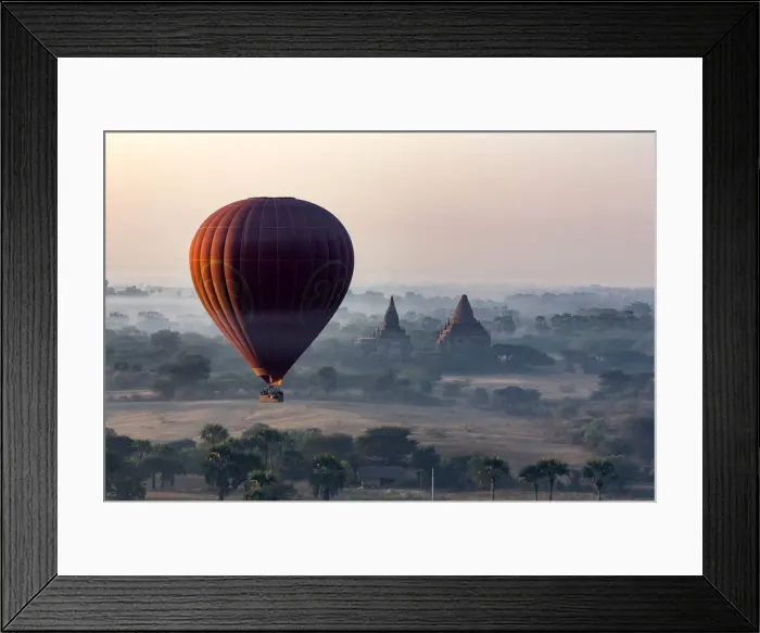 Framed Print : A hot air balloon flies over a temple at sunrise on a misty morning, Bagan, Myanmar Framed Print : A hot air balloon flies over a temple at sunrise on a misty morning, Bagan, Myanmar