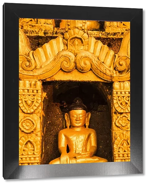 Mrauk-U, Rakhine state, Myanmar. Detail of a small Buddha statue in a stupa