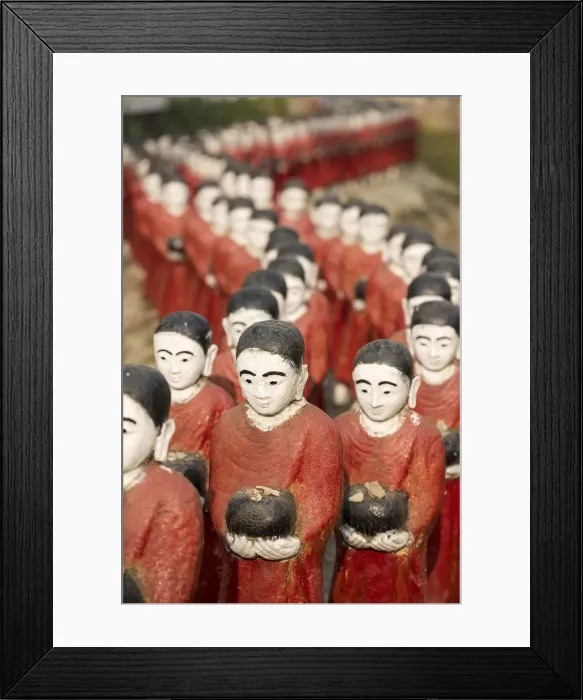 Framed Print : Rakhine state, Myanmar. Monks statues lined up in a pagoda