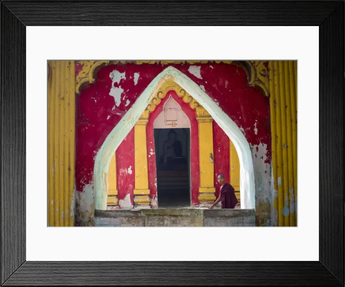 Framed Print : Amarapura, Mandalay region, Myanmar. Monk through the window of a colorful pagoda Framed Print : Amarapura, Mandalay region, Myanmar. Monk through the window of a colorful pagoda