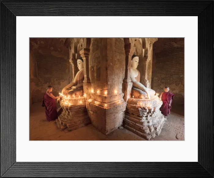 Framed Print : Young Buddhist monks pray in front of a statue of Buddha in a temple in Bagan, Myanmar Framed Print : Young Buddhist monks pray in front of a statue of Buddha in a temple in Bagan, Myanmar