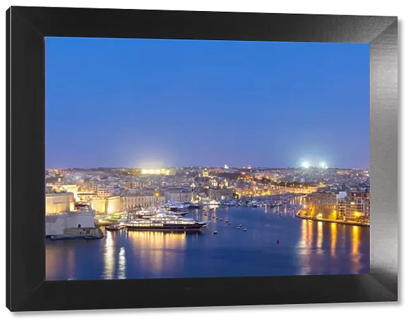 Malta, South Eastern Region, Valletta. Grand Harbour and the Three Cities at dusk