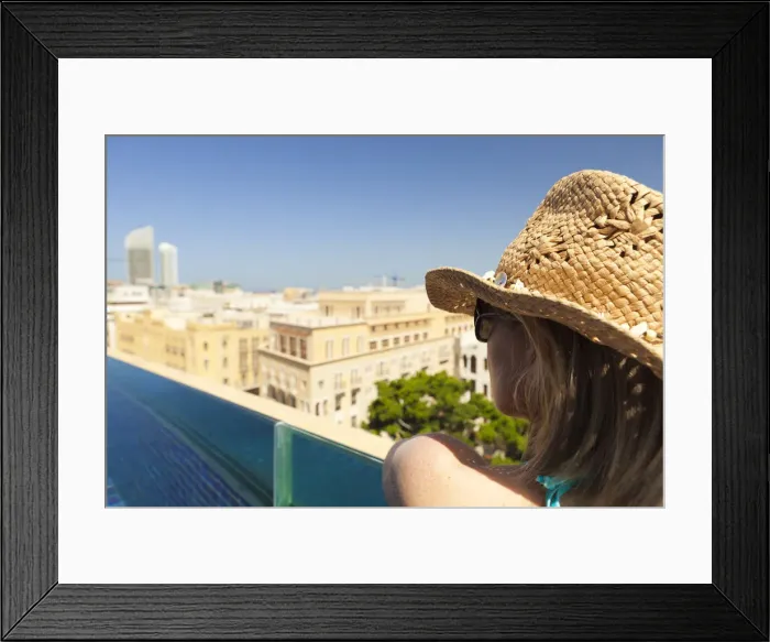 Framed Print : Lebanon, Beirut. A woman looks out over Beirut from the rooftop pool of the Le Gray Hotel Framed Print : Lebanon, Beirut. A woman looks out over Beirut from the rooftop pool of the Le Gray Hotel