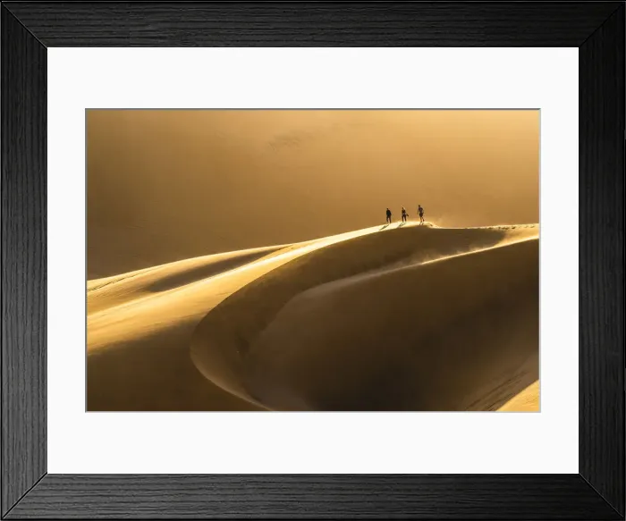 Framed Print : Walvis Bay, Namibia, Africa. Tourists walking on the sand dunes at sunset