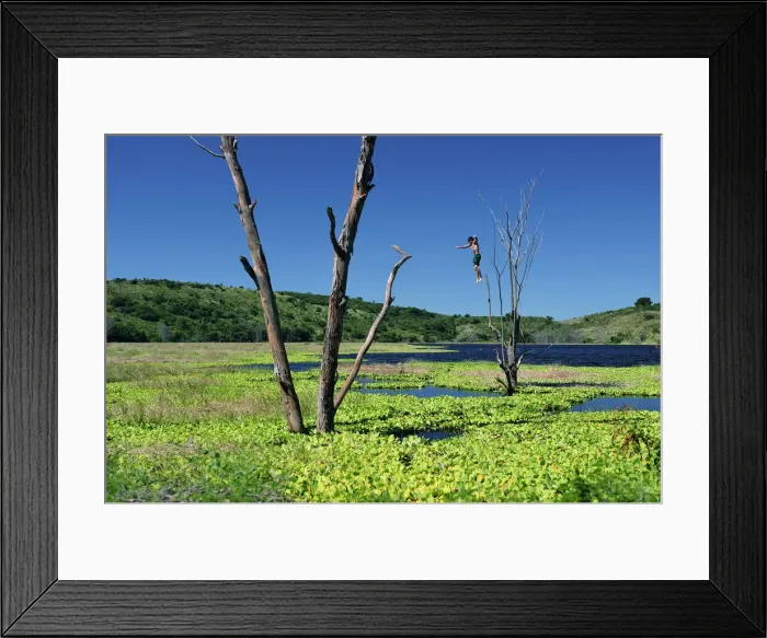 Framed Print : Boy jumping into lake Lagune, Nicaragua, Central America Framed Print : Boy jumping into lake Lagune, Nicaragua, Central America