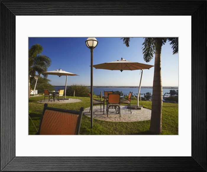 Framed Print : Tables and chairs in grounds of Hotel Cardoso, Maputo, Mozambique Framed Print : Tables and chairs in grounds of Hotel Cardoso, Maputo, Mozambique