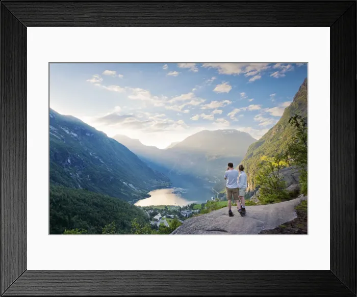 Framed Print : Norway, Western Fjords, Geiranger Fjord, Couple standing on rock infront of Fjord Framed Print : Norway, Western Fjords, Geiranger Fjord, Couple standing on rock infront of Fjord
