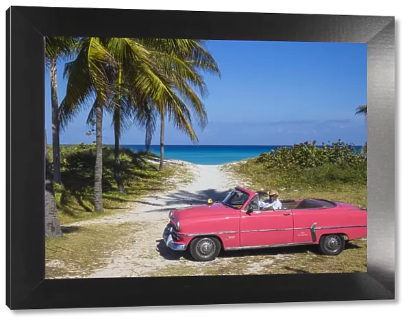 Cuba, Varadero, Pink Plymouth car on Varadero beach
