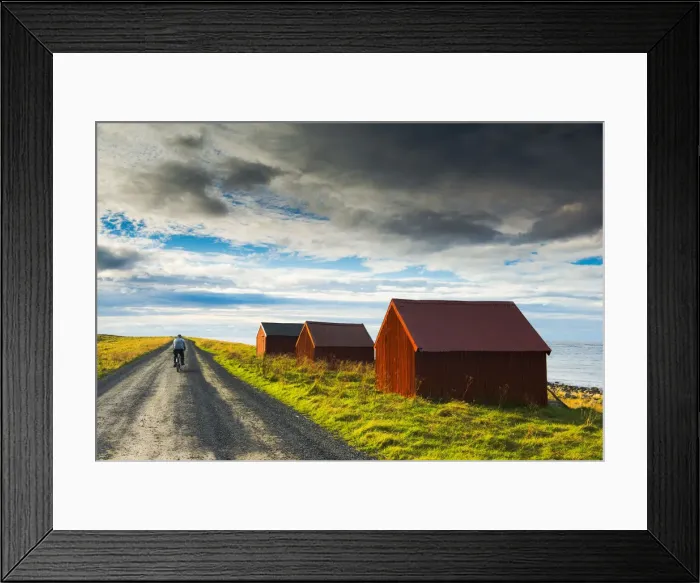 Framed Print : Man on Bike & Red Fishing Huts, Eggum, Lofoten Islands, Norway Framed Print : Man on Bike & Red Fishing Huts, Eggum, Lofoten Islands, Norway