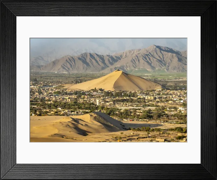Framed Print : City of Ica viewed from dune at Huacachina against mountains, Ica Region, Peru Framed Print : City of Ica viewed from dune at Huacachina against mountains, Ica Region, Peru