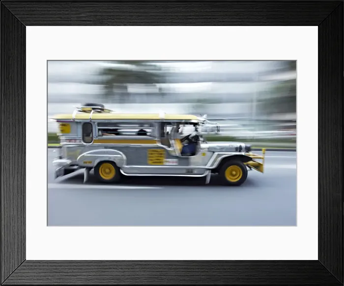 Framed Print : Asia, South East Asia, Philippines, Manila, a jeepney speeding through Makati Framed Print : Asia, South East Asia, Philippines, Manila, a jeepney speeding through Makati