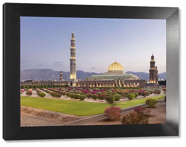 A view of the mosque and gardens illuminated in the evening, Sultan Qaboos grand mosque