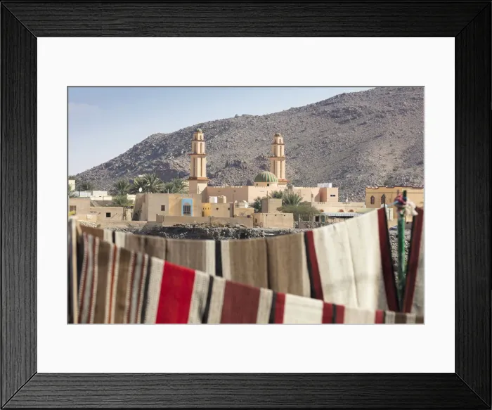 Framed Print : A mosque with carpets hanging in the foreground, Nizwa, Oman Framed Print : A mosque with carpets hanging in the foreground, Nizwa, Oman