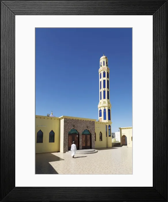 Framed Print : A mullah walks into a colourful mosque for the call to prayer, Nizwa, Ad Dakhiliyah Framed Print : A mullah walks into a colourful mosque for the call to prayer, Nizwa, Ad Dakhiliyah