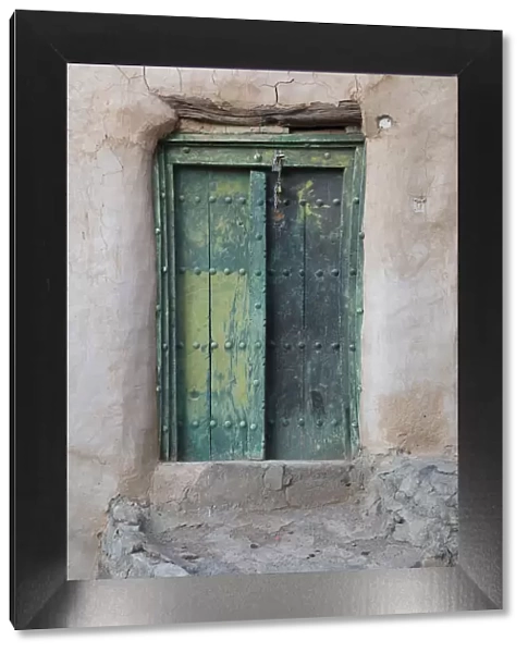 Oman, Ad Dakhiliyah region, Al Hamra, Misfat Al Abreen, Old green, wooden door in