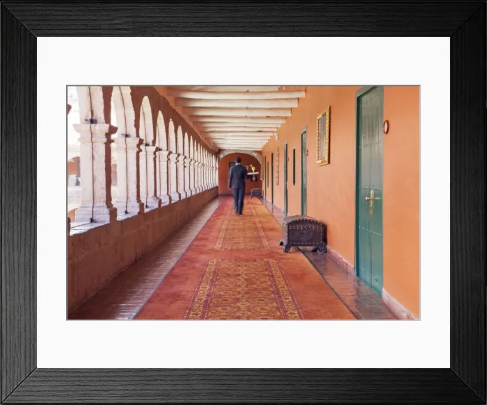 Framed Print : South America, Peru, Cusco, a waiter carrying a tray with a cocktail to a room in Framed Print : South America, Peru, Cusco, a waiter carrying a tray with a cocktail to a room in