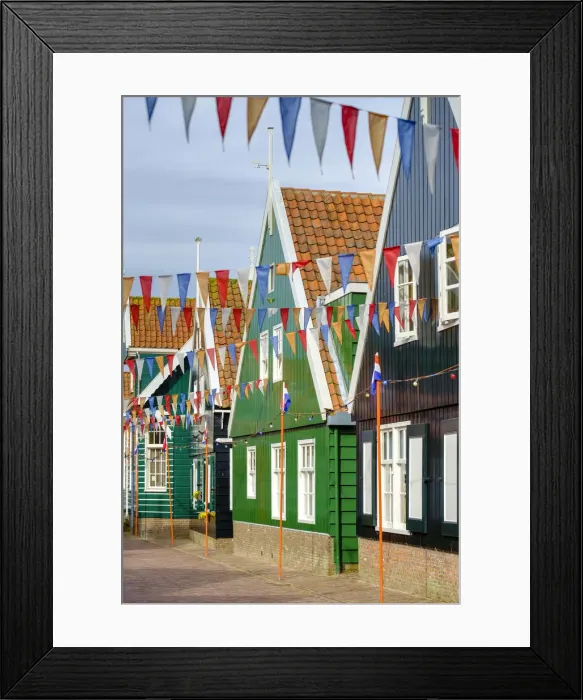 Framed Print : Traditional wooden houses decorated with flags of Dutch national colors for Koningsdag Framed Print : Traditional wooden houses decorated with flags of Dutch national colors for Koningsdag