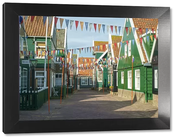 Streets of Marken decorated for Koningsdag, or Kings Day, with flags of Dutch